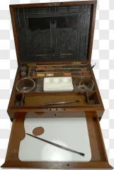 An antique wooden watercolor paint box with brushes and a palette on a transparent background.